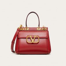 Valentino Garavani Medium Rockstud Handbag In Grainy Calfskin Red